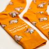 Orange socks with flying pigs over them and the AA logo in white