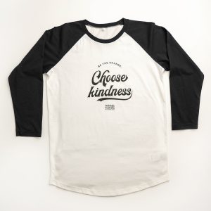 'Choose kindness' logo on white shirt with black sleeves, shoulders and neck