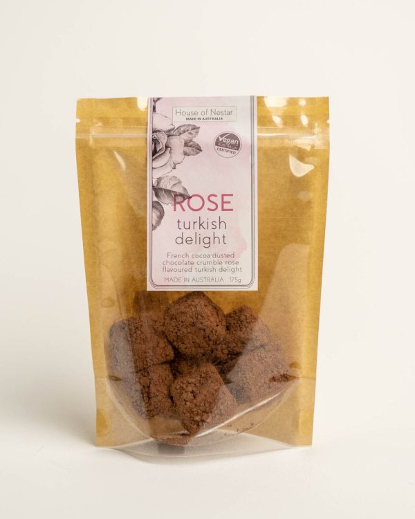 A packet of rose turkish delight treats on a plain background