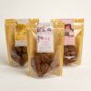 Three packets of various vegan chocolate coated treats