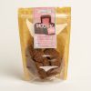 Front shot of 'Mooshy strawberry marshmallow'. Brown and clear packet. Pink label