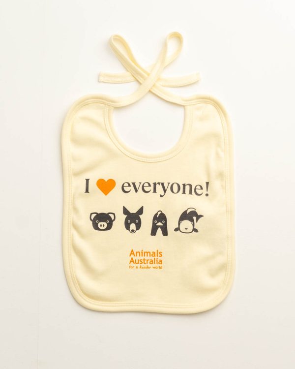 Ecru coloured baby bib with four cartoon animal faces - a pig, a kangaroo, a chicken and a fish - and the Animals Australia logo. Quote - "I "heart" everyone"