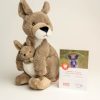 Plush kangaroo toy with joey a joey in her pouch and the adoption certificate