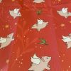 Red wrapping paper with flying pig print