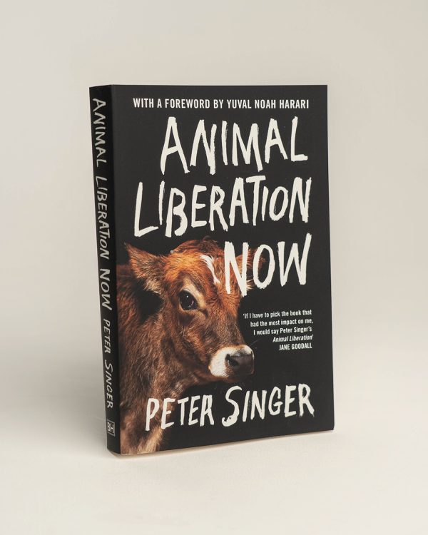 Front cover of 'Animal Liberation Now' book. Black with white writing and a picture of a calf