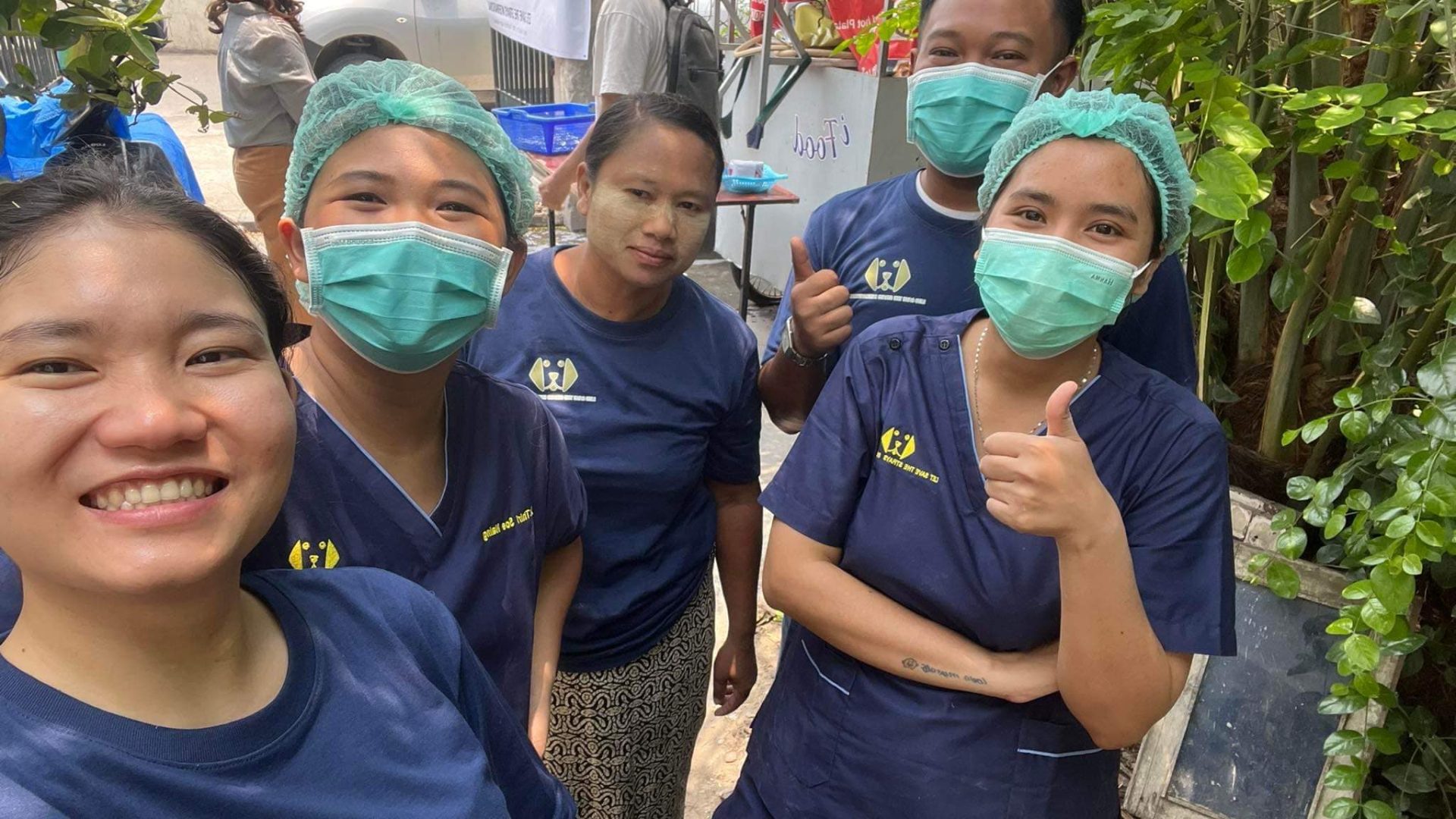 A group photo of five members of the Let's Save the Strays team smiling.