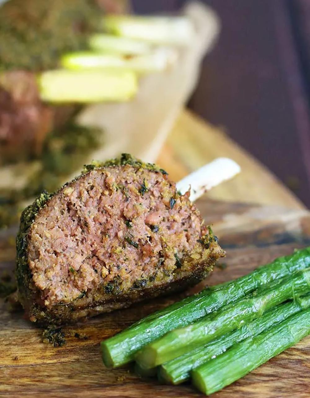 A rack of tofu 'lamb' has been sliced open, showing a juicy centre.