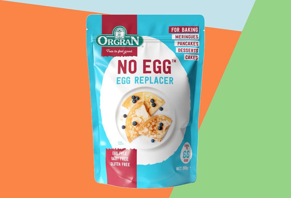 A packet of Orgran No Egg on a colourful geometric background.